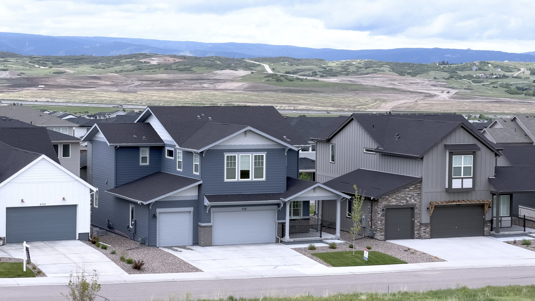 Double residential garage doors on Canadian home driveway