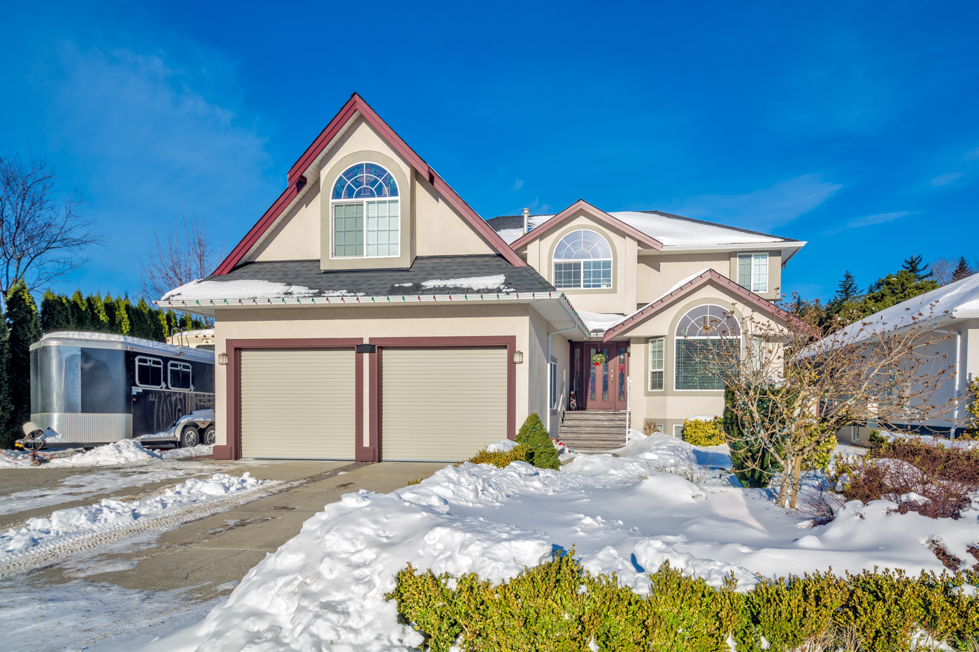 White double garage door installation on Canadian home