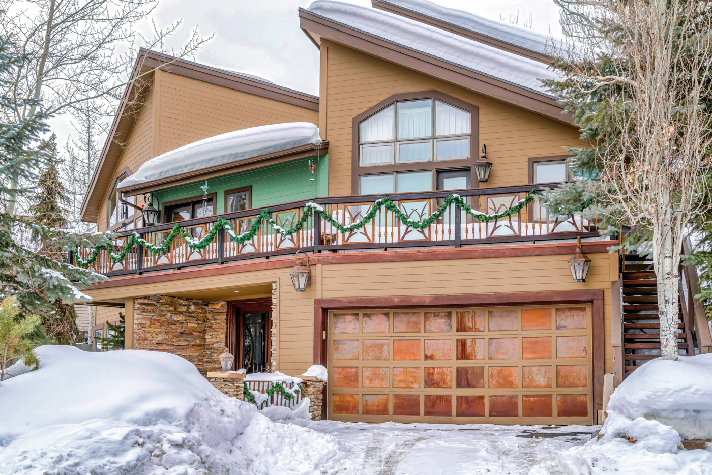 Modern black garage doors on Canadian home
