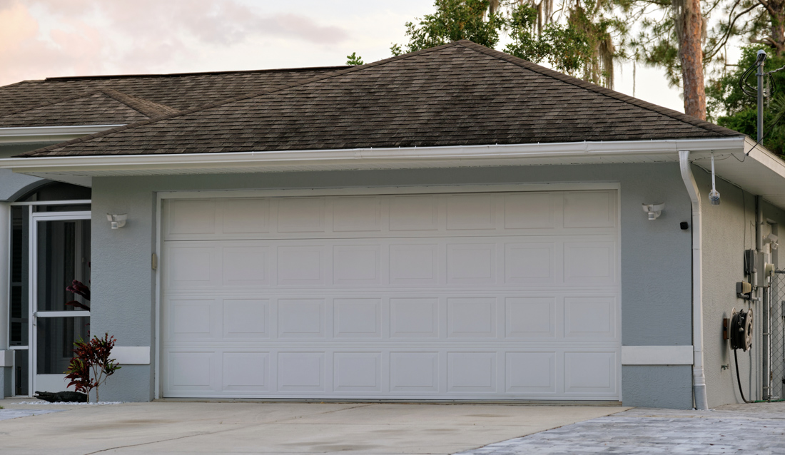 Double garage door installation on Ottawa brick home