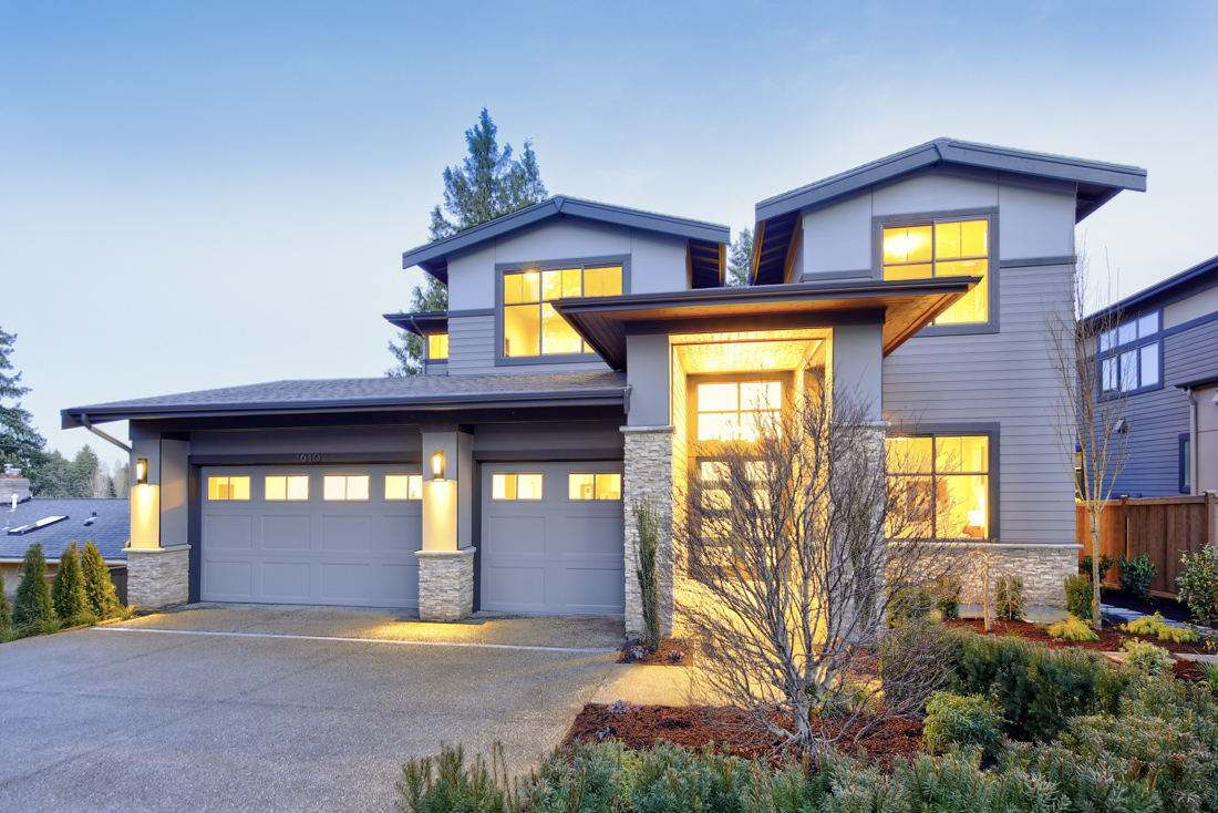 Three-car garage doors on modern Canadian homes