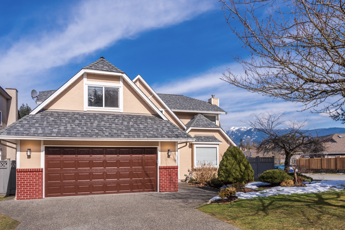 Modern residential garage door in Mississauga driveway