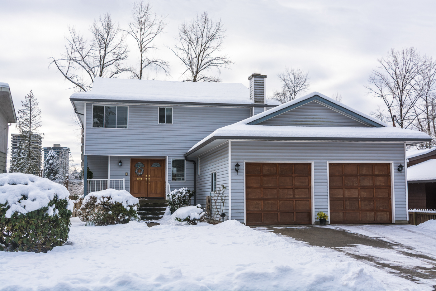 Modern double garage door on Canadian home driveway