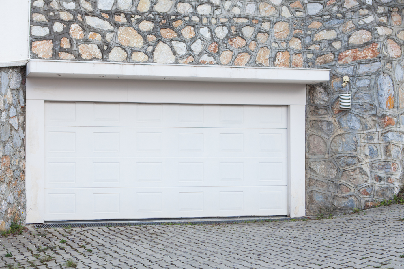 Modern residential garage doors on quiet Canadian home
