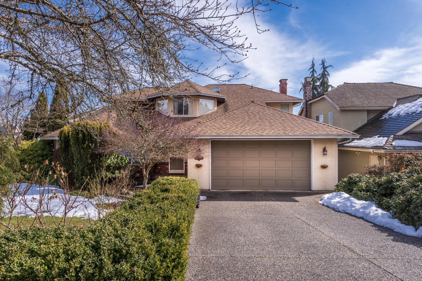 Modern wooden garage doors on a Canadian home