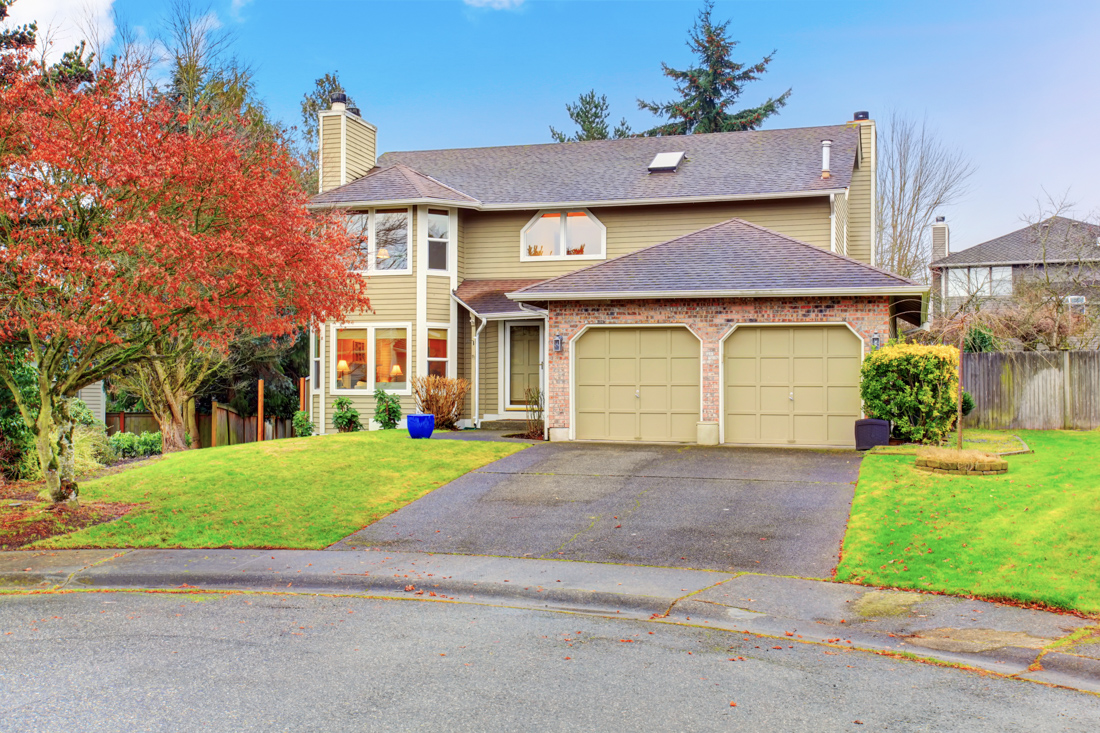 Residential home with double garage doors