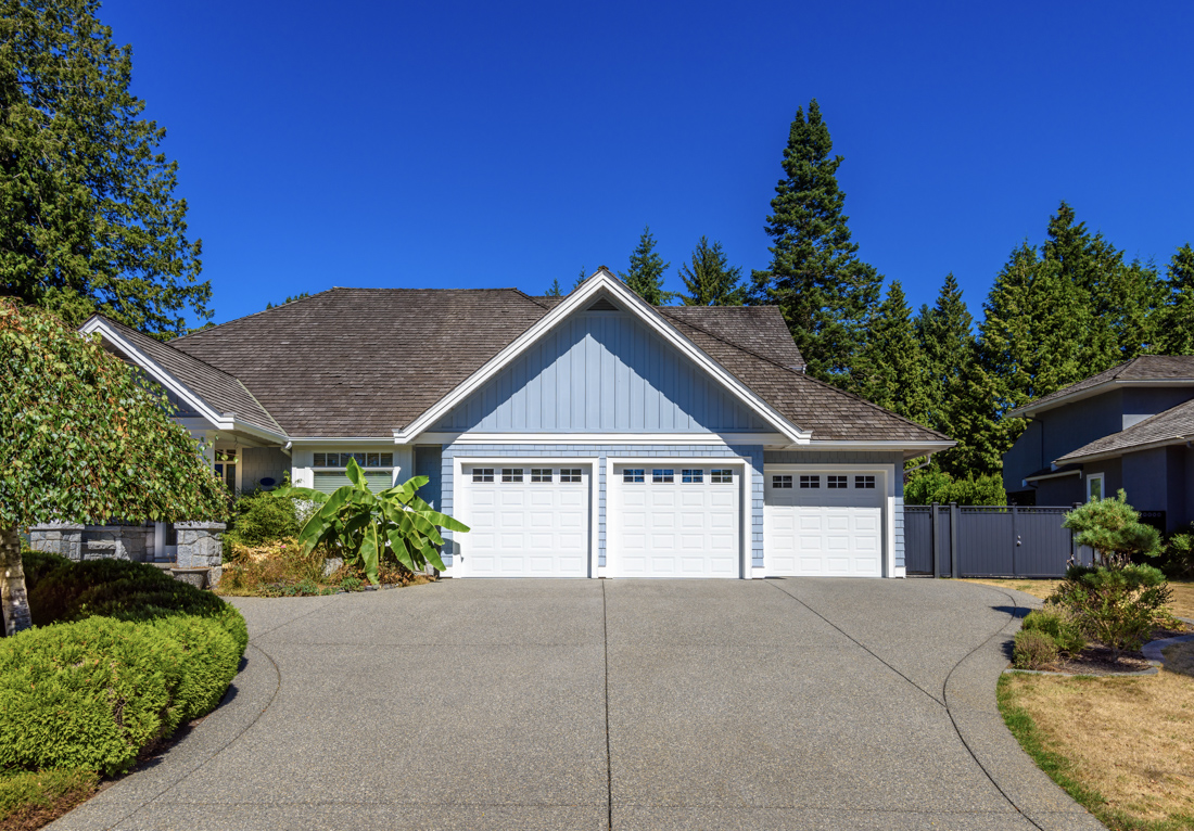 Modern Canadian home with white garage doors