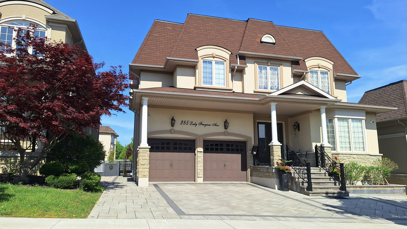 Residential garage doors on Canadian home driveway